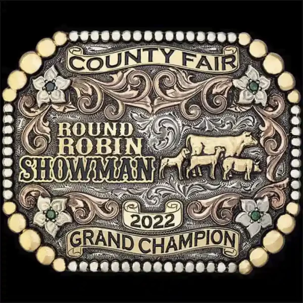 The County Fair Custom Belt Buckle features a berry edge, copper scrolls and bronze scrolls, and lettering. Customize it for a perfect rodeo trophy, gift or western accesory!